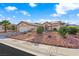 Charming one-story home with low-maintenance desert landscaping and a two-car garage on a sunny day at 2725 Byron Dr, Las Vegas, NV 89134