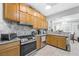 Updated kitchen with stainless steel appliances, granite countertops, and ample cabinet space at 2725 Byron Dr, Las Vegas, NV 89134