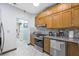Charming kitchen with stainless steel appliances, wooden cabinets, and tile floors at 2725 Byron Dr, Las Vegas, NV 89134
