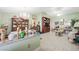 Open-concept living and dining area with tile floors, chandelier, and comfortable seating at 2725 Byron Dr, Las Vegas, NV 89134