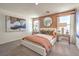 Cozy bedroom showcasing a bed with decorative pillows, side tables, and natural light from two windows at 3402 La Cura Ave # Lot 69, Las Vegas, NV 89141