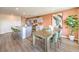 Open-concept dining area connected to the kitchen, showcasing a large table and modern appliances at 3402 La Cura Ave # Lot 69, Las Vegas, NV 89141
