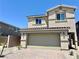 Two story home with a two car garage and brick driveway at 3402 La Cura Ave # Lot 69, Las Vegas, NV 89141