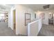 Upstairs hallway featuring neutral carpet, bright white walls, and entryways to bedrooms and bathrooms at 3402 La Cura Ave # Lot 69, Las Vegas, NV 89141