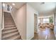 Inviting hallway with a staircase leading to the upper level, and an open view of the living area at 3402 La Cura Ave # Lot 69, Las Vegas, NV 89141
