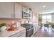 Modern kitchen with stainless steel appliances, quartz countertops, and gray cabinets at 3402 La Cura Ave # Lot 69, Las Vegas, NV 89141