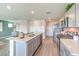 Modern kitchen with stainless steel appliances, quartz countertops, and gray cabinets at 3402 La Cura Ave # Lot 69, Las Vegas, NV 89141