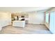 Bright, open concept kitchen with stainless steel appliances and a large island at 3402 La Cura Ave # Lot 69, Las Vegas, NV 89141