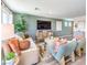 Cozy living room with stylish decor, neutral tones, and views of the backyard at 3402 La Cura Ave # Lot 69, Las Vegas, NV 89141