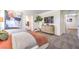 Spacious main bedroom featuring modern decor, a large wall-mounted TV, and an ensuite bathroom at 3402 La Cura Ave # Lot 69, Las Vegas, NV 89141