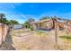 Spacious backyard featuring a wooden fence and detached storage shed, ideal for outdoor activities at 4100 Montebello Ave, Las Vegas, NV 89110