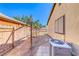 The backyard features a pergola, air conditioning unit and partially fenced perimeter at 4100 Montebello Ave, Las Vegas, NV 89110