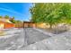 Charming single-story home featuring a spacious front yard with mature trees and covered parking at 4100 Montebello Ave, Las Vegas, NV 89110
