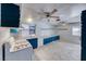 Bright kitchen features white countertops, blue cabinetry, and ample lighting at 4100 Montebello Ave, Las Vegas, NV 89110