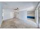 Open-concept living room with carpet floors and bright lighting at 4100 Montebello Ave, Las Vegas, NV 89110