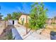 View of the home's shed, located on the property's side yard and nestled next to mature trees at 4100 Montebello Ave, Las Vegas, NV 89110