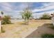 Spacious backyard featuring a brick wall, a tree, and potential for landscaping and outdoor activities at 419 National St, Henderson, NV 89015