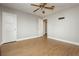 Spacious bedroom featuring wood floors, neutral paint, and two closets at 419 National St, Henderson, NV 89015