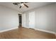 Bedroom featuring neutral walls, wood floors, and walk through closet at 419 National St, Henderson, NV 89015