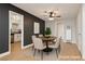 Dining area featuring a round table with chairs, contrasting walls, and modern lighting at 419 National St, Henderson, NV 89015