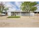 Inviting single-story house with a well-maintained front yard and a classic chain link fence at 419 National St, Henderson, NV 89015