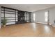 Spacious living room with a stone fireplace, built-in shelving, and light wood flooring at 419 National St, Henderson, NV 89015