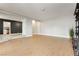 Large living room with laminate floors, showcasing an open doorway and access to other rooms at 419 National St, Henderson, NV 89015