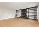 Spacious living room featuring laminate flooring, built-in shelving, and a stone fireplace at 419 National St, Henderson, NV 89015