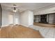 Spacious living room showcasing laminate flooring, a ceiling fan, and a doorway to another room at 419 National St, Henderson, NV 89015