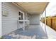 Covered patio area with a table and a gray floor, perfect for outdoor dining or relaxation at 419 National St, Henderson, NV 89015