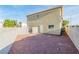 Flat backyard features a gravel ground cover and block fence for privacy at 4195 Story Rock St, Las Vegas, NV 89115