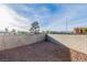 Flat backyard features a gravel ground cover and block fence for privacy at 4195 Story Rock St, Las Vegas, NV 89115