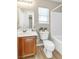 Neutral toned bathroom with wooden cabinets and large mirror at 4195 Story Rock St, Las Vegas, NV 89115
