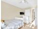 Bedroom with twin bed, dresser and door at 4195 Story Rock St, Las Vegas, NV 89115