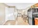 Dining area with laminate flooring, adjacent to the kitchen, providing a seamless flow at 4195 Story Rock St, Las Vegas, NV 89115