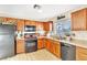 Kitchen with laminate flooring, stainless steel sink, and a black gas range at 4195 Story Rock St, Las Vegas, NV 89115