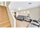 Inviting living area featuring a plush grey sofa and bright, natural light at 4195 Story Rock St, Las Vegas, NV 89115