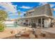 Inviting backyard featuring a pool, fire pit, and patio area, ideal for outdoor entertaining at 4666 Plata Del Sol Dr, Las Vegas, NV 89121