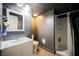 Bathroom featuring a vanity with a white sink, toilet, and shower at 4666 Plata Del Sol Dr, Las Vegas, NV 89121
