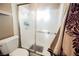 Bathroom with a toilet and glass shower doors at 4666 Plata Del Sol Dr, Las Vegas, NV 89121