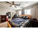 Comfortable bedroom with ceiling fan, decorative lighting, and closet in the background at 4666 Plata Del Sol Dr, Las Vegas, NV 89121