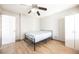 A modest bedroom with wood-look floors and a neutral color scheme at 4666 Plata Del Sol Dr, Las Vegas, NV 89121
