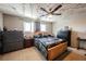 Cozy bedroom with ceiling fan, decorative lights, and furniture at 4666 Plata Del Sol Dr, Las Vegas, NV 89121