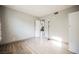 Neutral bedroom with laminate flooring, closet and interior door at 4666 Plata Del Sol Dr, Las Vegas, NV 89121