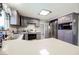 Renovated kitchen featuring stainless appliances and white countertops at 4666 Plata Del Sol Dr, Las Vegas, NV 89121