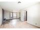 Spacious living room with a fireplace, hardwood floors, and a view into another room at 4666 Plata Del Sol Dr, Las Vegas, NV 89121