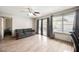 Bright living room with backyard views, a ceiling fan and lots of windows at 4666 Plata Del Sol Dr, Las Vegas, NV 89121