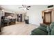 Open floor plan combining the kitchen and living space with wood flooring at 4666 Plata Del Sol Dr, Las Vegas, NV 89121