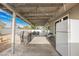 A covered patio with a dining area and grill, great for outdoor cooking and gatherings at 4666 Plata Del Sol Dr, Las Vegas, NV 89121