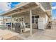 A covered patio with a dining area and grill, great for outdoor cooking and gatherings at 4666 Plata Del Sol Dr, Las Vegas, NV 89121